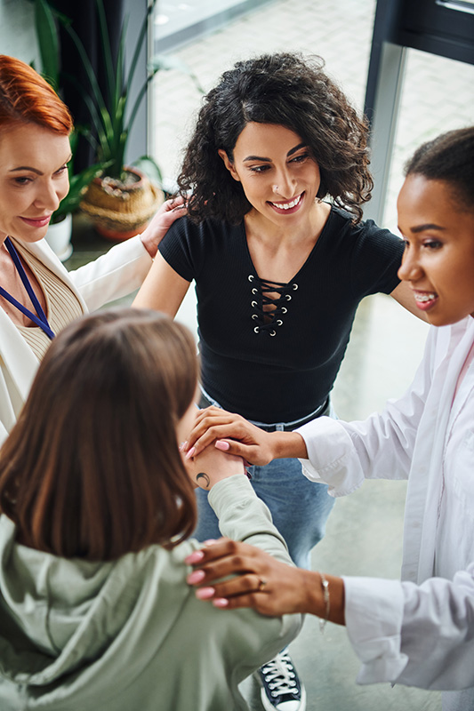 People participate in group therapy at a drug rehab.