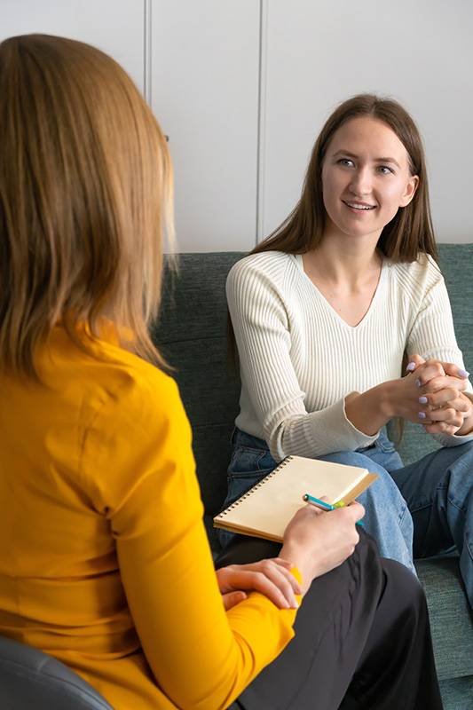 A person participates in therapy at a drug rehab.