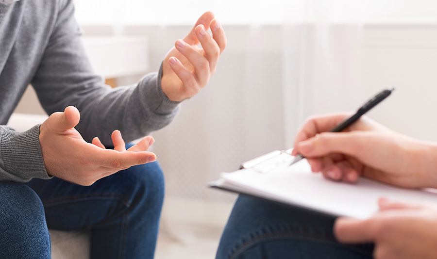 A person participates in therapy at a drug rehab center.