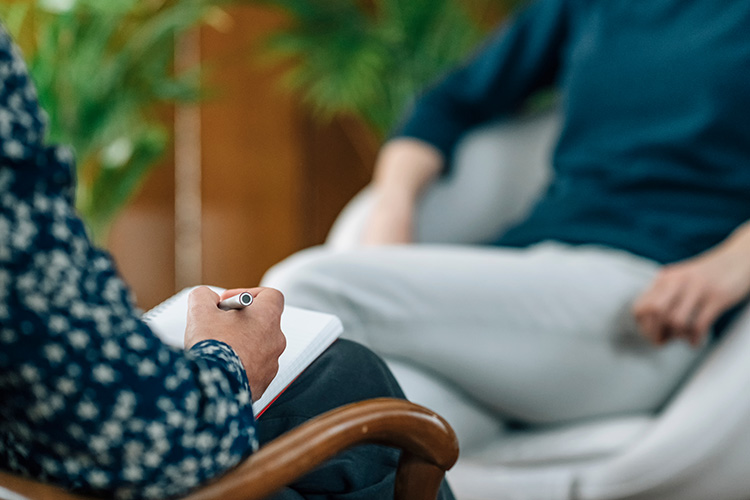 A person participates in therapy at a drug rehab center.