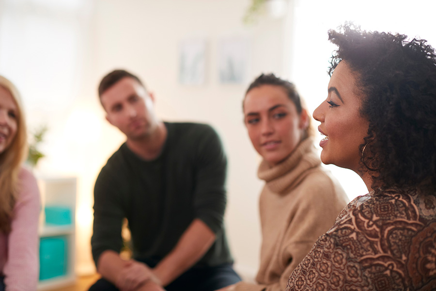 People participate in therapy as part of a bipolar disorder treatment program.