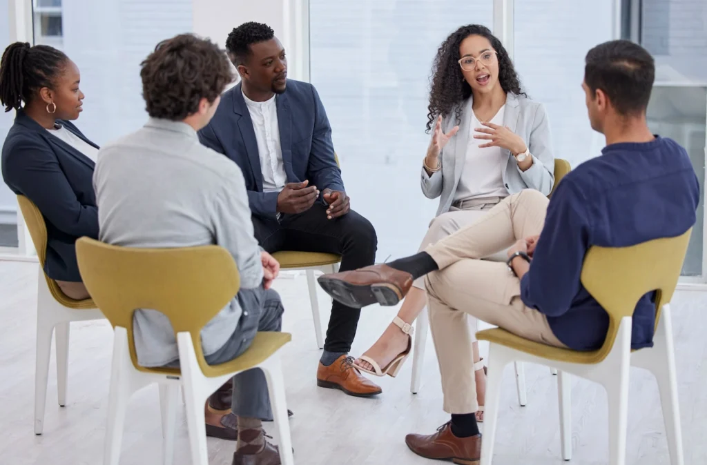 People participate in therapy at a drug rehab.