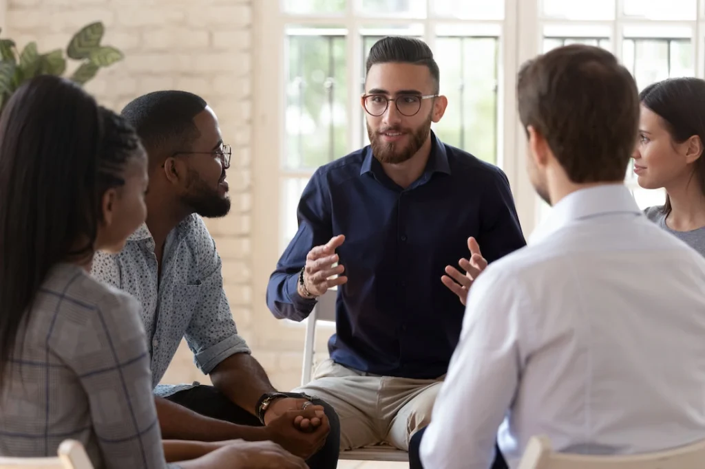 People participate in therapy at a drug rehab center.