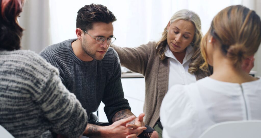 Man getting support at an alcohol rehab revere.