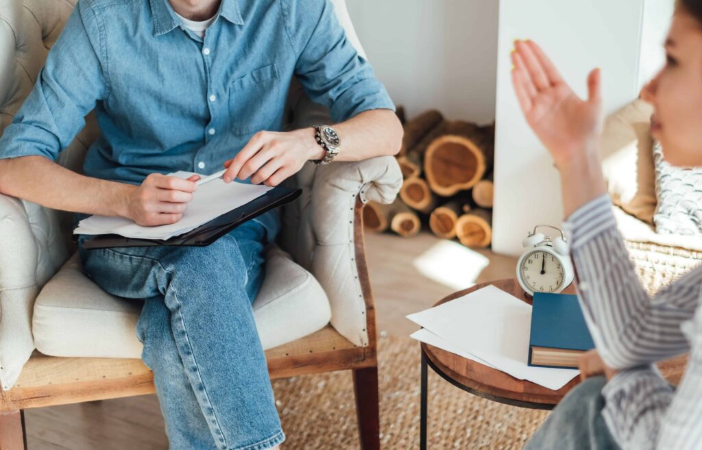 Woman talking to therapist at a drug rehab ipswich.