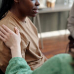 Woman getting support after asking herself what is sobriety.