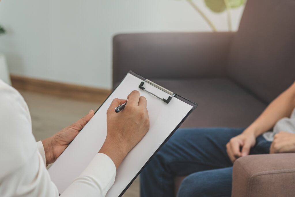 Woman talking to her therapist at a Drug and Alcohol Rehab in Barnstable County.