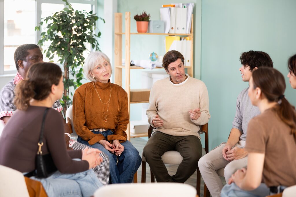 Group of men and women talking at drug rehab in new bedford ma.